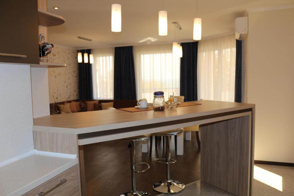 Kuchyň nebo kuchyňský kout v ubytování Vello Apartments
