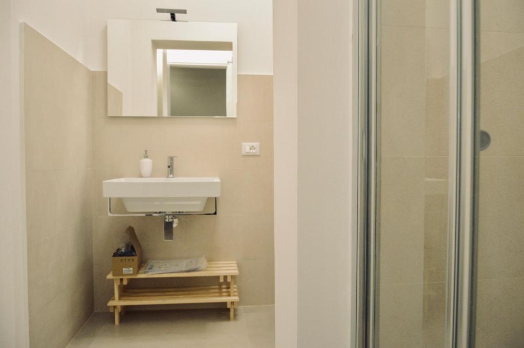 a bathroom with a sink and a shower at Casa Lighea Mondello - 200 mt dalla spiaggia in Mondello