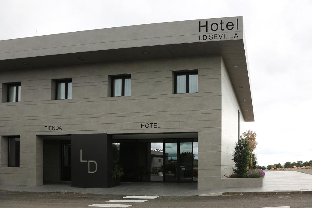 a hotel with a sign on the front of it at LD Sevilla in Guillena