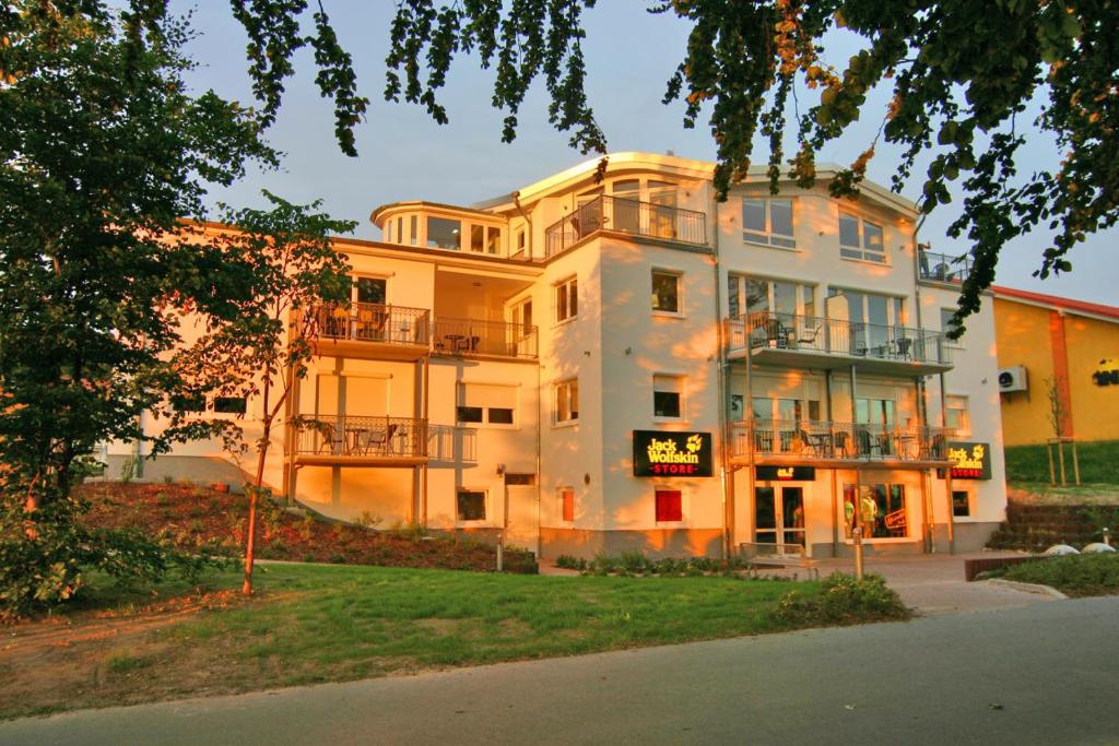 a large white building with a sign on it at Villa Seeluft - by Rujana in Ostseebad Sellin