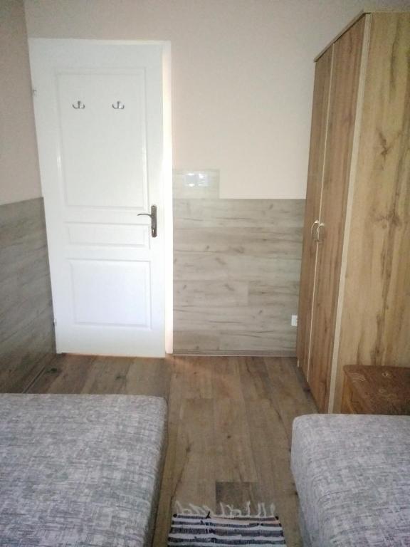 Postel nebo postele na pokoji v ubytování Budai Vám Apartmanház