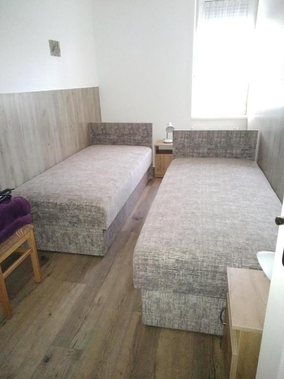 Postel nebo postele na pokoji v ubytování Budai Vám Apartmanház
