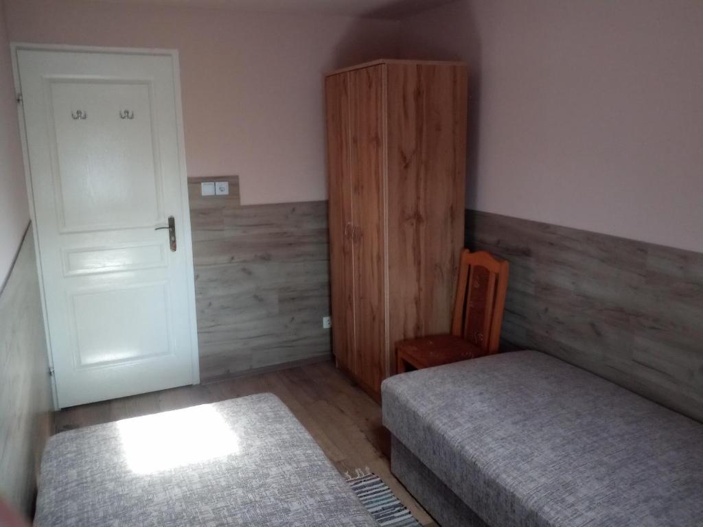 Postel nebo postele na pokoji v ubytování Budai Vám Apartmanház