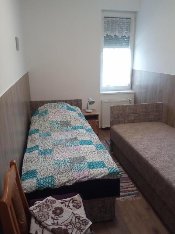 Postel nebo postele na pokoji v ubytování Budai Vám Apartmanház