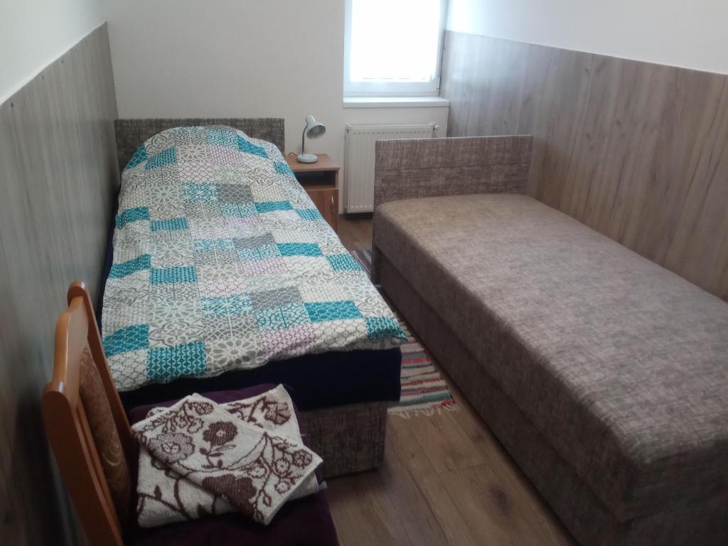 Postel nebo postele na pokoji v ubytování Budai Vám Apartmanház