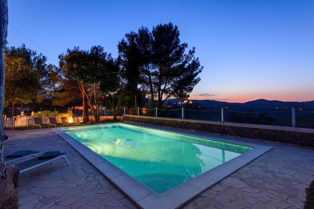 a swimming pool in the middle of a yard at San Miguel Park in Sant Miquel de Balansat