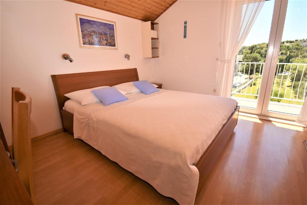 Posteľ alebo postele v izbe v ubytovaní Guesthouse Kanjuo