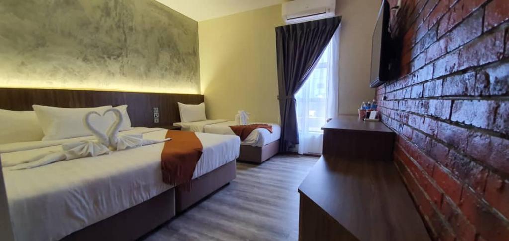 Postel nebo postele na pokoji v ubytování VISTA HOTEL