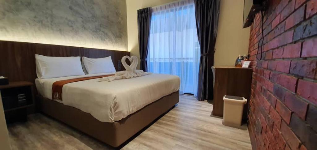 Postel nebo postele na pokoji v ubytování VISTA HOTEL