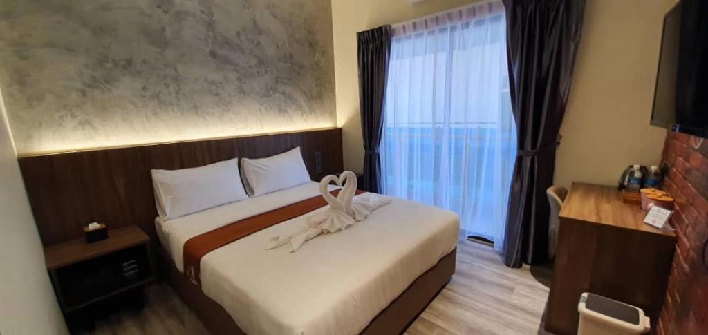 Postel nebo postele na pokoji v ubytování VISTA HOTEL