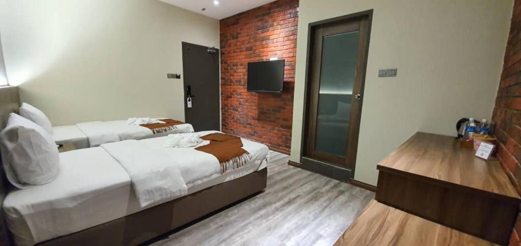 Postel nebo postele na pokoji v ubytování VISTA HOTEL