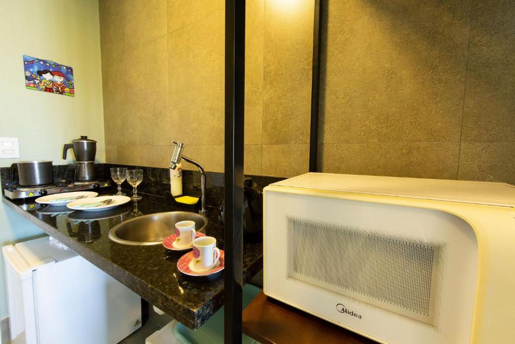  Flat novo próximo à orla no Ilusion Hotel por Carpediem