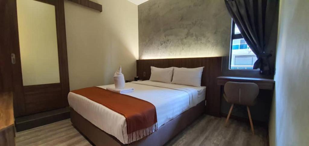 Postel nebo postele na pokoji v ubytování VISTA HOTEL