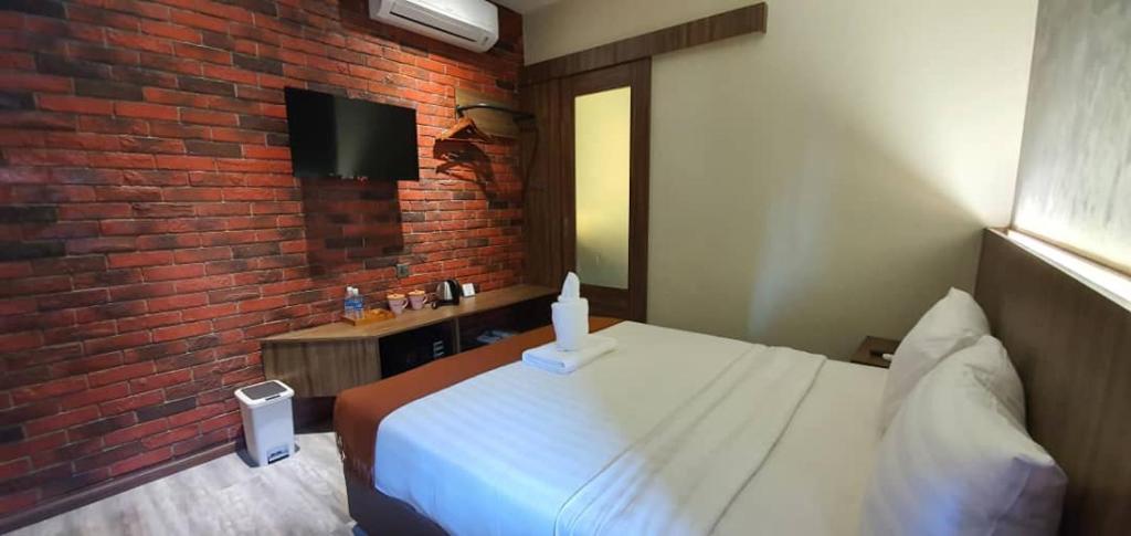 Postel nebo postele na pokoji v ubytování VISTA HOTEL