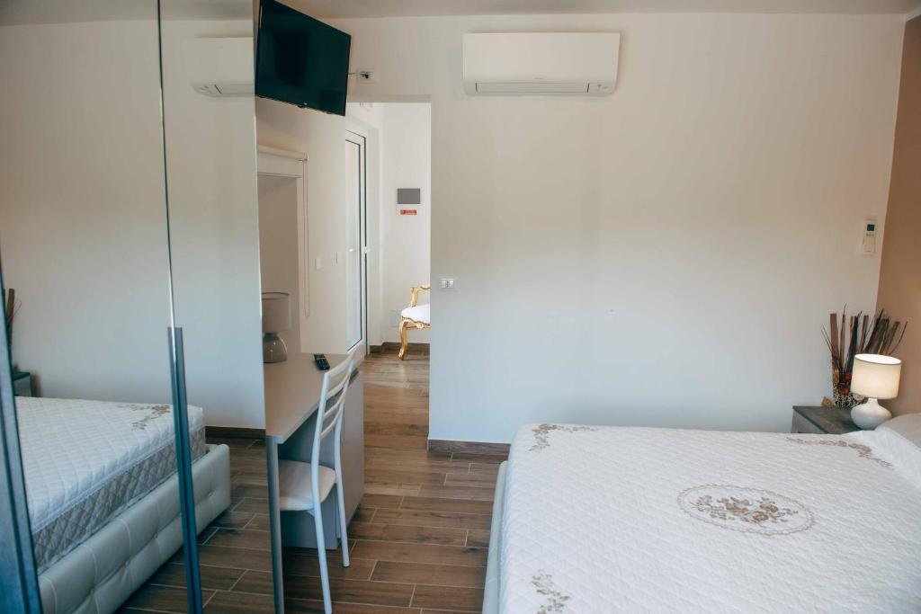 Posteľ alebo postele v izbe v ubytovaní Affitta camere La Fenice di Folli Lorella