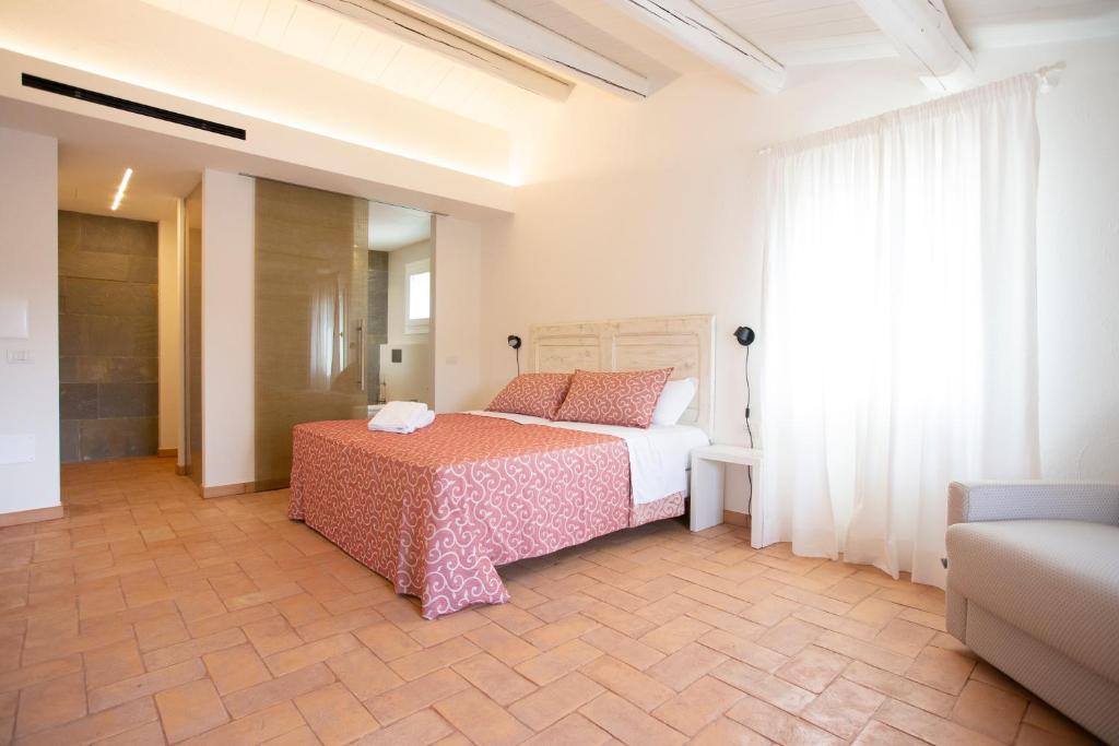 Postel nebo postele na pokoji v ubytování Agriturismo Torre del Marino