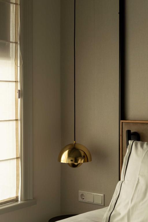 Postel nebo postele na pokoji v ubytování Aparthotel Hattem
