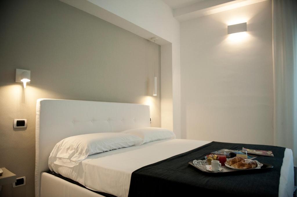 Кровать или кровати в номере Hotel Villa Felice Relais