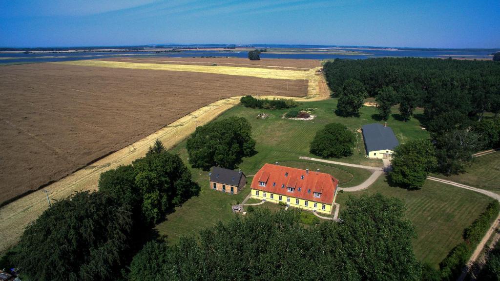 an aerial view of a large house with a red roof at Ferienhaus Gut Rattelvitz Insel Rügen in Gingst