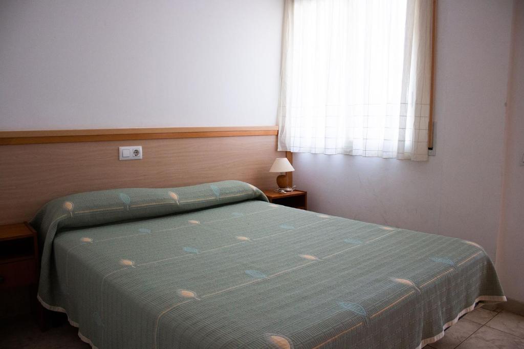 Posteľ alebo postele v izbe v ubytovaní Apartaments La Torreta
