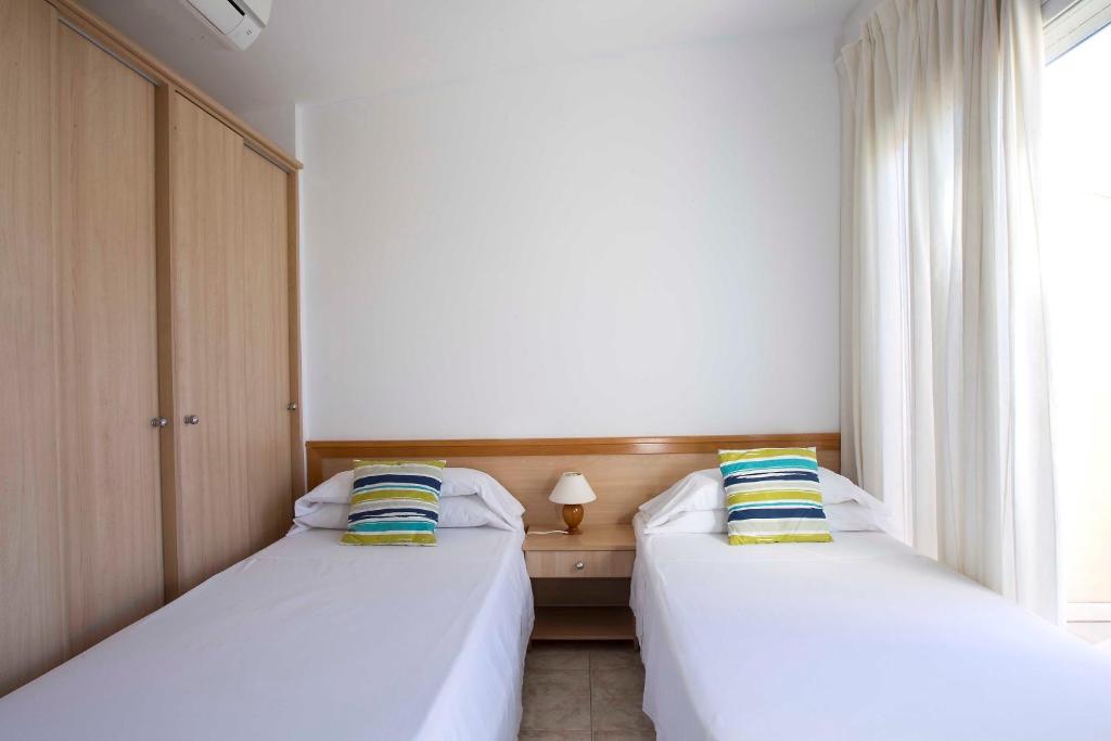 Posteľ alebo postele v izbe v ubytovaní Apartaments La Torreta