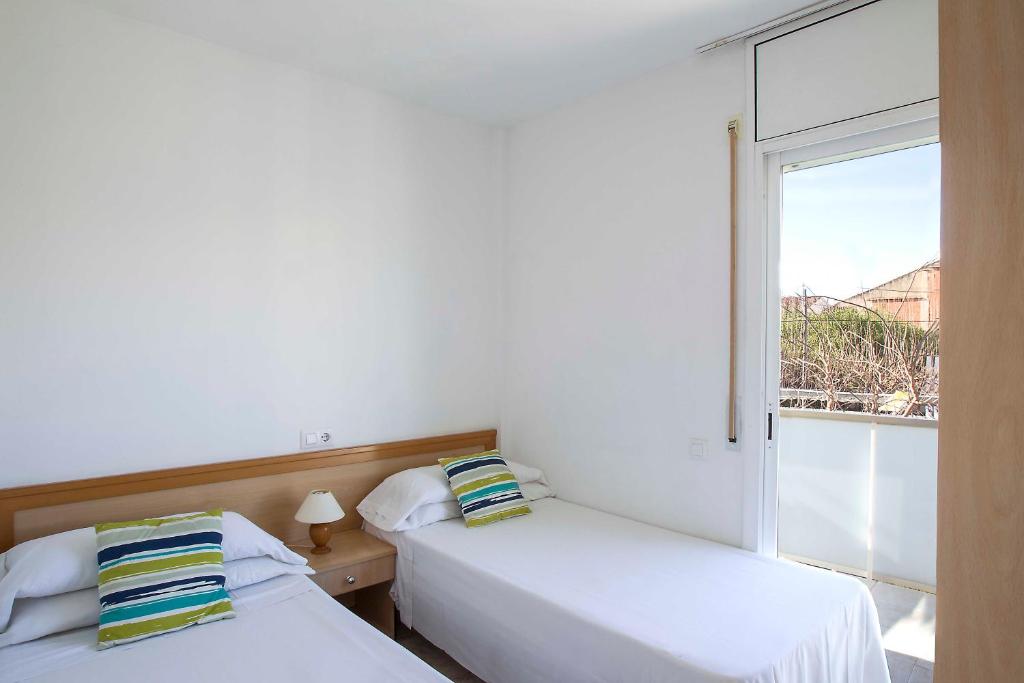 Posteľ alebo postele v izbe v ubytovaní Apartaments La Torreta