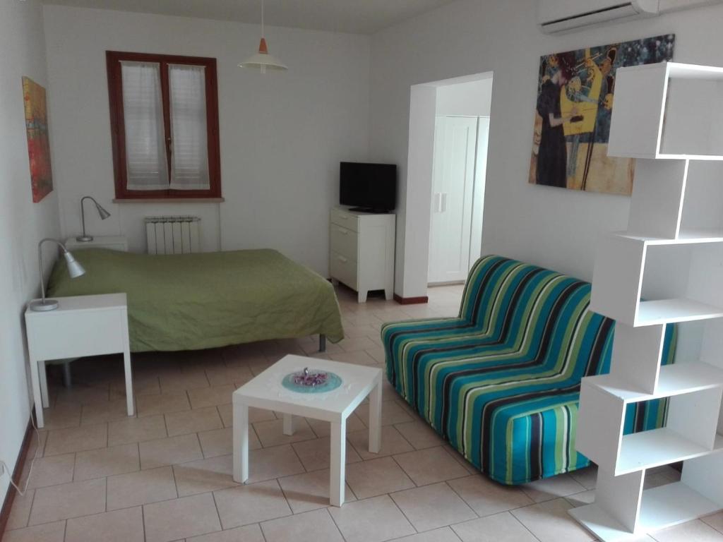 Posteľ alebo postele v izbe v ubytovaní Country House-B&B-Appartamenti Ai Cipressi