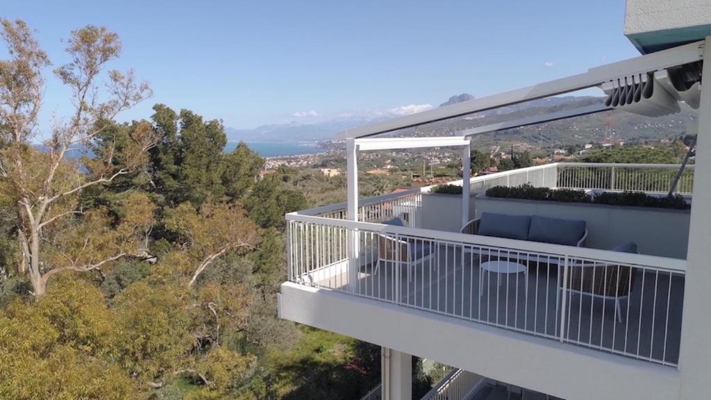 a balcony of a house with a view of trees at Principe Alogna Hotel & SPA in Altavilla Milicia