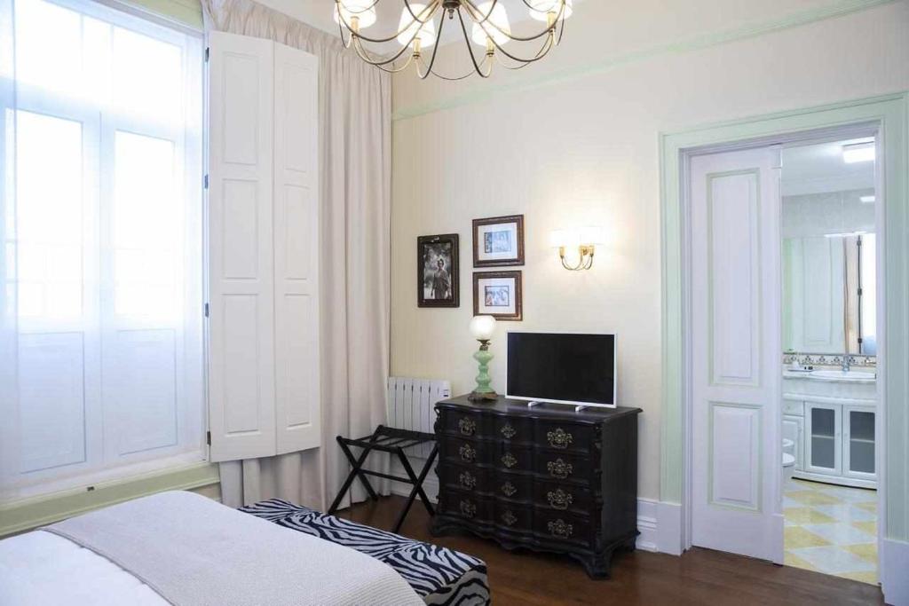 Postel nebo postele na pokoji v ubytování Casa da Granja Boutique