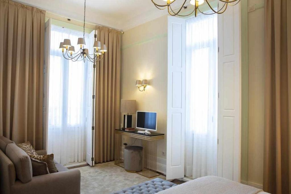 TV a/nebo společenská místnost v ubytování Casa da Granja Boutique