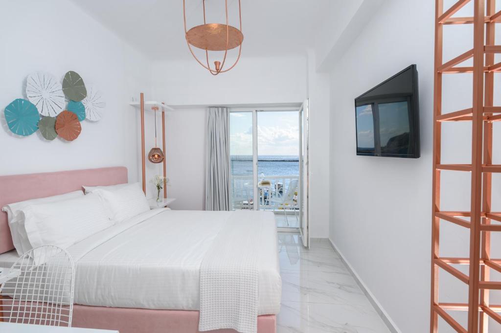 Łóżko lub łóżka w pokoju w obiekcie Nama Boutique Hotel