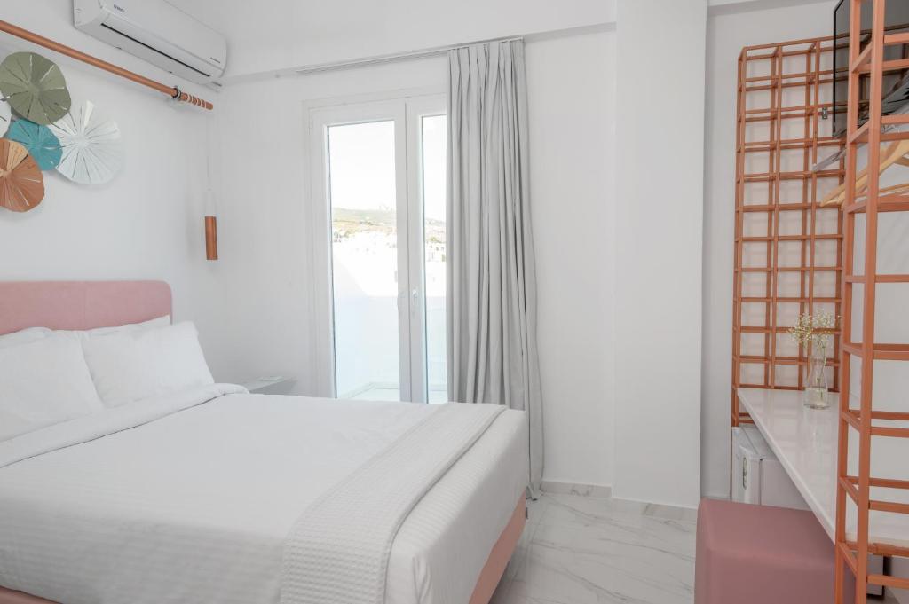 Łóżko lub łóżka w pokoju w obiekcie Nama Boutique Hotel