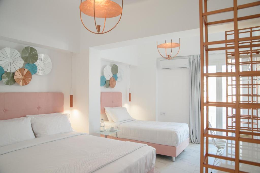 Łóżko lub łóżka w pokoju w obiekcie Nama Boutique Hotel