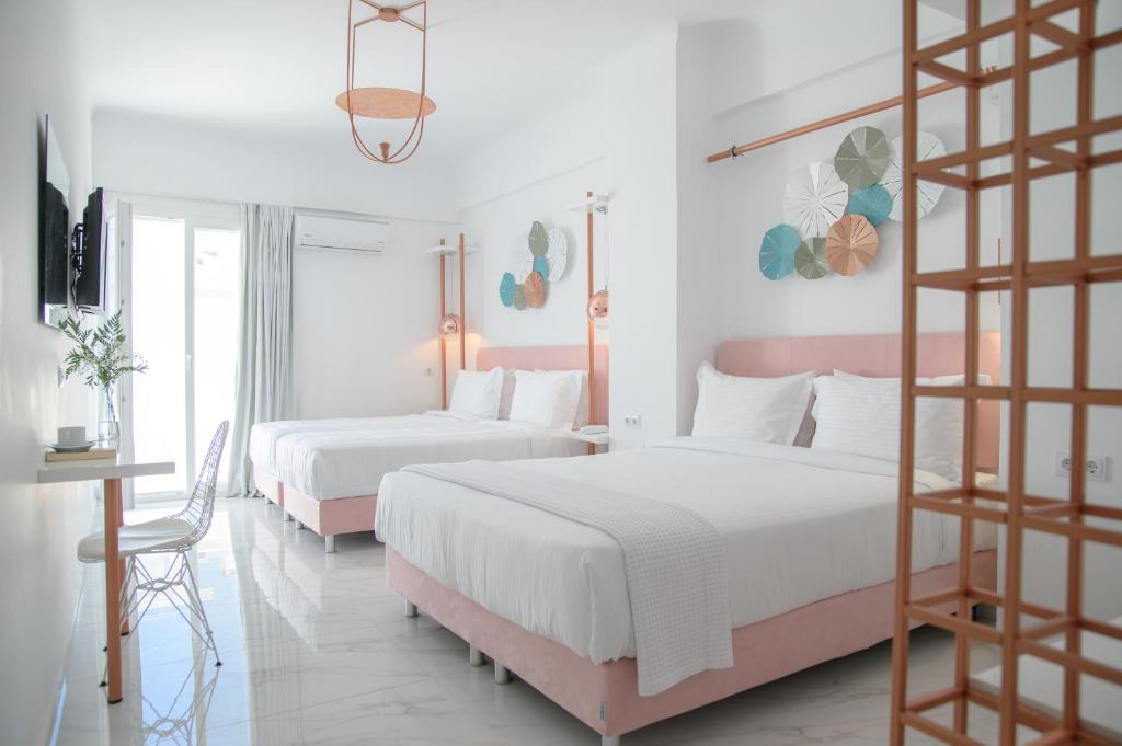 Łóżko lub łóżka w pokoju w obiekcie Nama Boutique Hotel