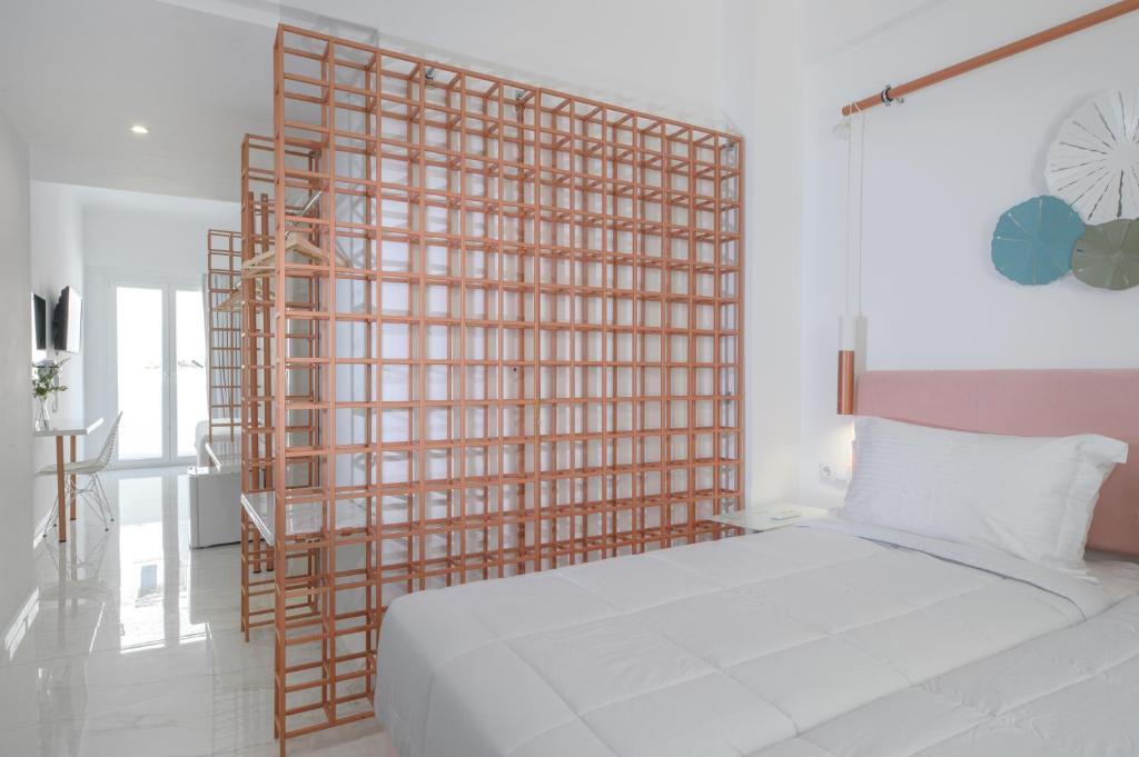 Łóżko lub łóżka w pokoju w obiekcie Nama Boutique Hotel