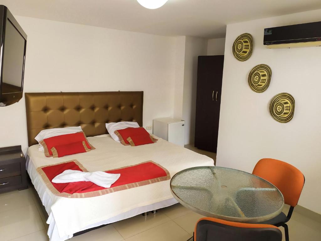 Postel nebo postele na pokoji v ubytování Hotel Plaza Colonial
