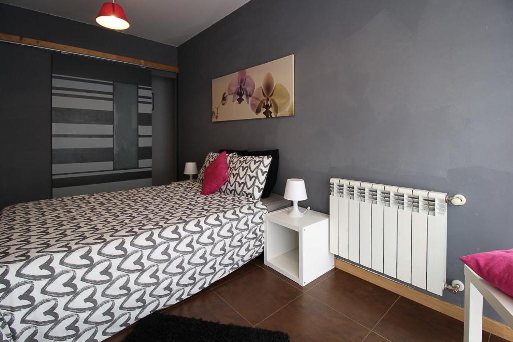 A bed or beds in a room at Apartamentos El Cuco