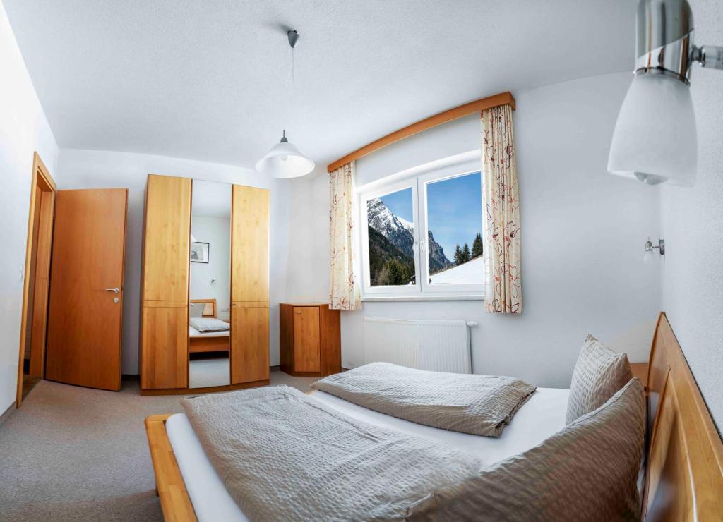 Postel nebo postele na pokoji v ubytování Adlerhof