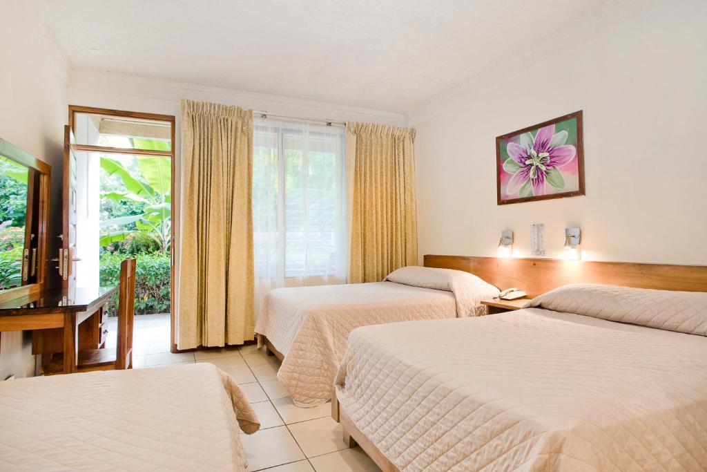 Postel nebo postele na pokoji v ubytování Hotel Boyeros