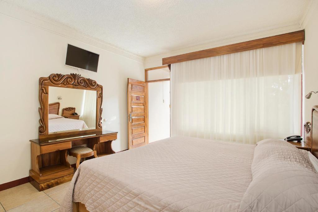 Postel nebo postele na pokoji v ubytování Hotel Boyeros