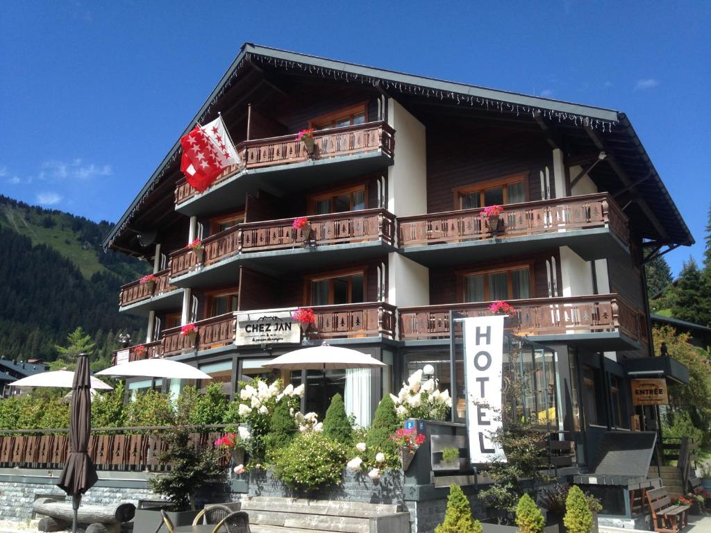 a hotel with a sign in front of it at Boutique-Hôtel Chez Jan in Morgins