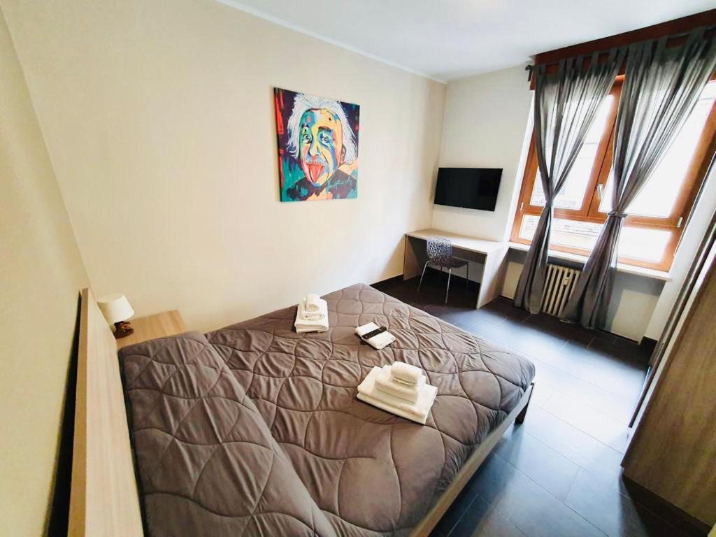 Łóżko lub łóżka w pokoju w obiekcie HH Hermoso Housing ALESSANDRIA