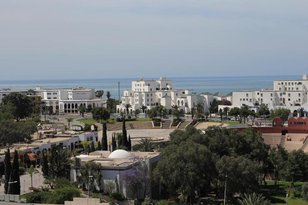 a view of a city with trees and buildings at Studiotel Afoud in Agadir