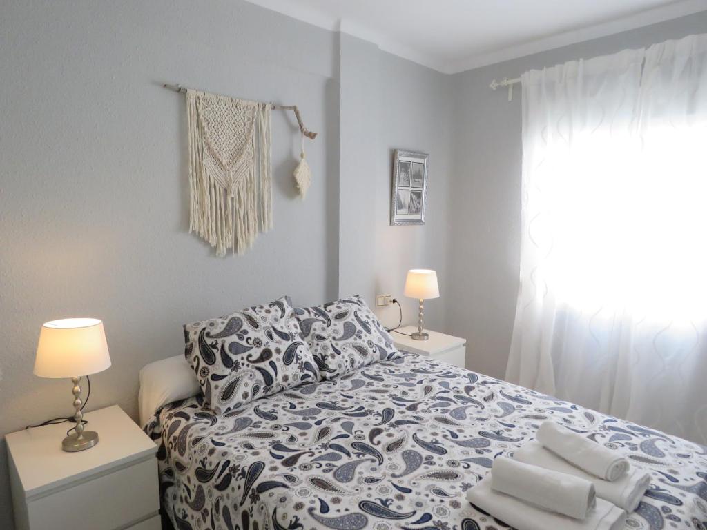 Posteľ alebo postele v izbe v ubytovaní Apartamento Avenida