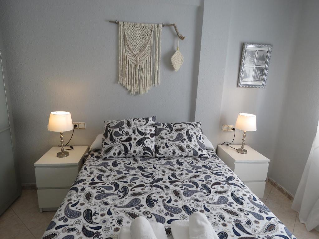Posteľ alebo postele v izbe v ubytovaní Apartamento Avenida