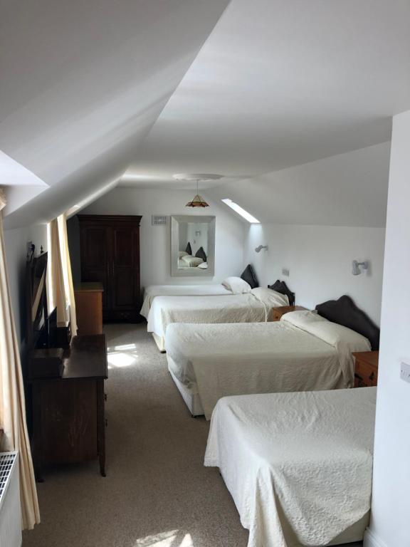 Postel nebo postele na pokoji v ubytování Rockville House B&B