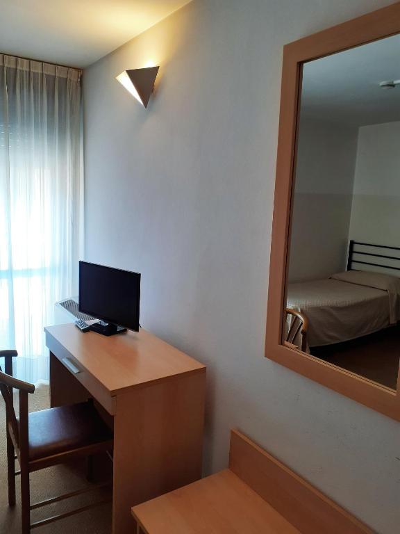 TV a/nebo společenská místnost v ubytování Albergo Ristorante Cicin