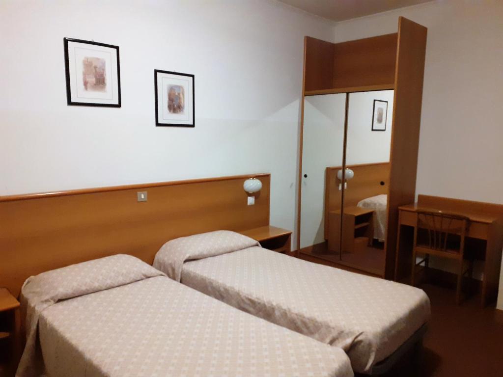 Postel nebo postele na pokoji v ubytování Albergo Ristorante Cicin