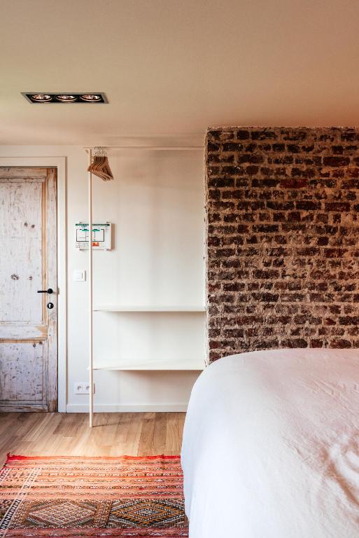 Postel nebo postele na pokoji v ubytování Chambre d'Amis by Alix