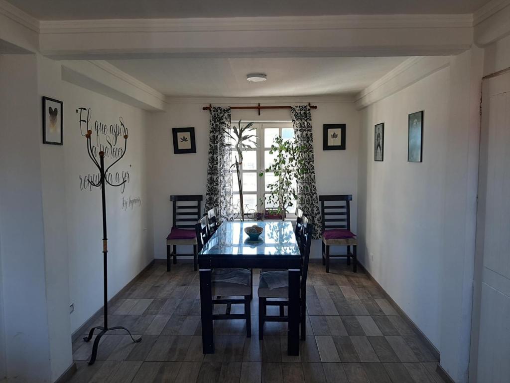 a dining room with a table and chairs at Rocio in Ushuaia